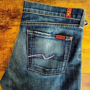 7 For All Mankind, size 30, blue denim jeans w/ pink rhinestones.